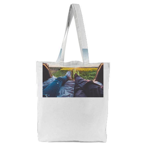 2 People Sitting With View Of Yellow Flowers During Daytime Tote Bag