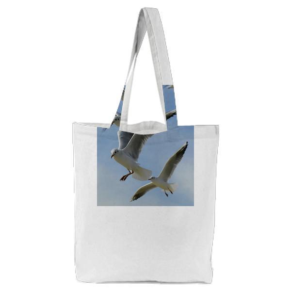 Flock Of Seagulls Flying During Daytime Tote Bag
