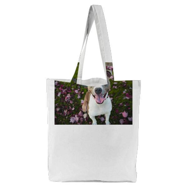 Photography Of White And Grey Short Coated Dog Sitting On Green Pink Leaf Covered Ground During Daytime Tote Bag