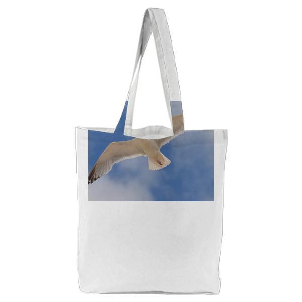 White Bird Flying Under The Blue And White Sky During Daytime Tote Bag