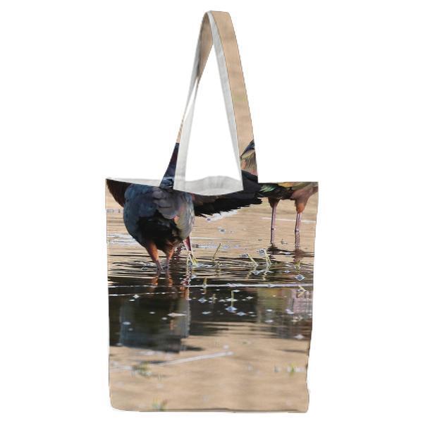 3 Brown And Black Long Beak Bird Eating On Body Of Water During Daytime Tote Bag
