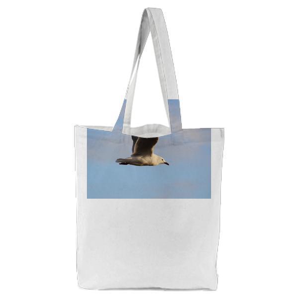White And Black Bird Flying During Daytime Tote Bag