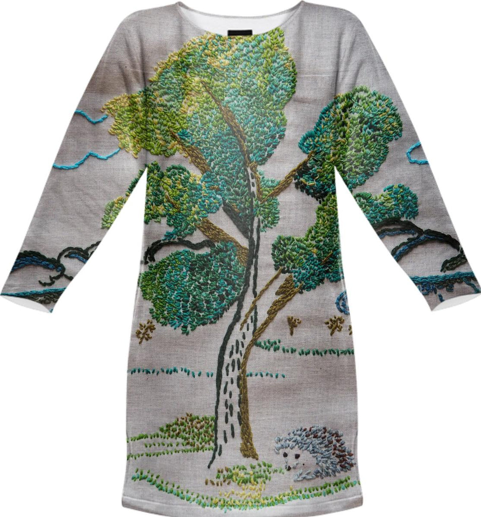 an embroidered tree with a hedgehog