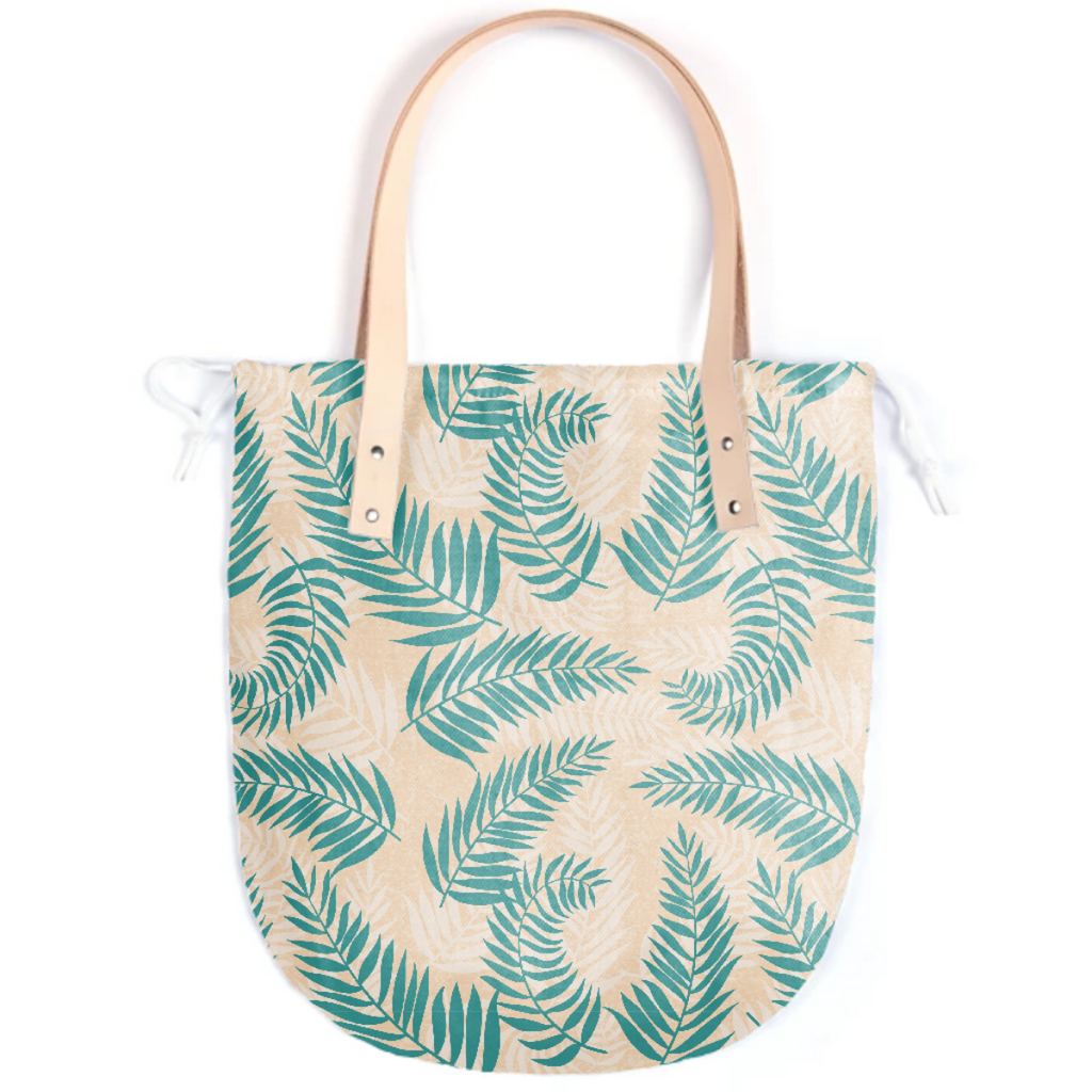 Green tropical palm leaves pattern on yellow background